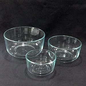 Set of three (3) aqua Pyrex bowls.